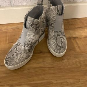 Boutique snakeskin wedges.